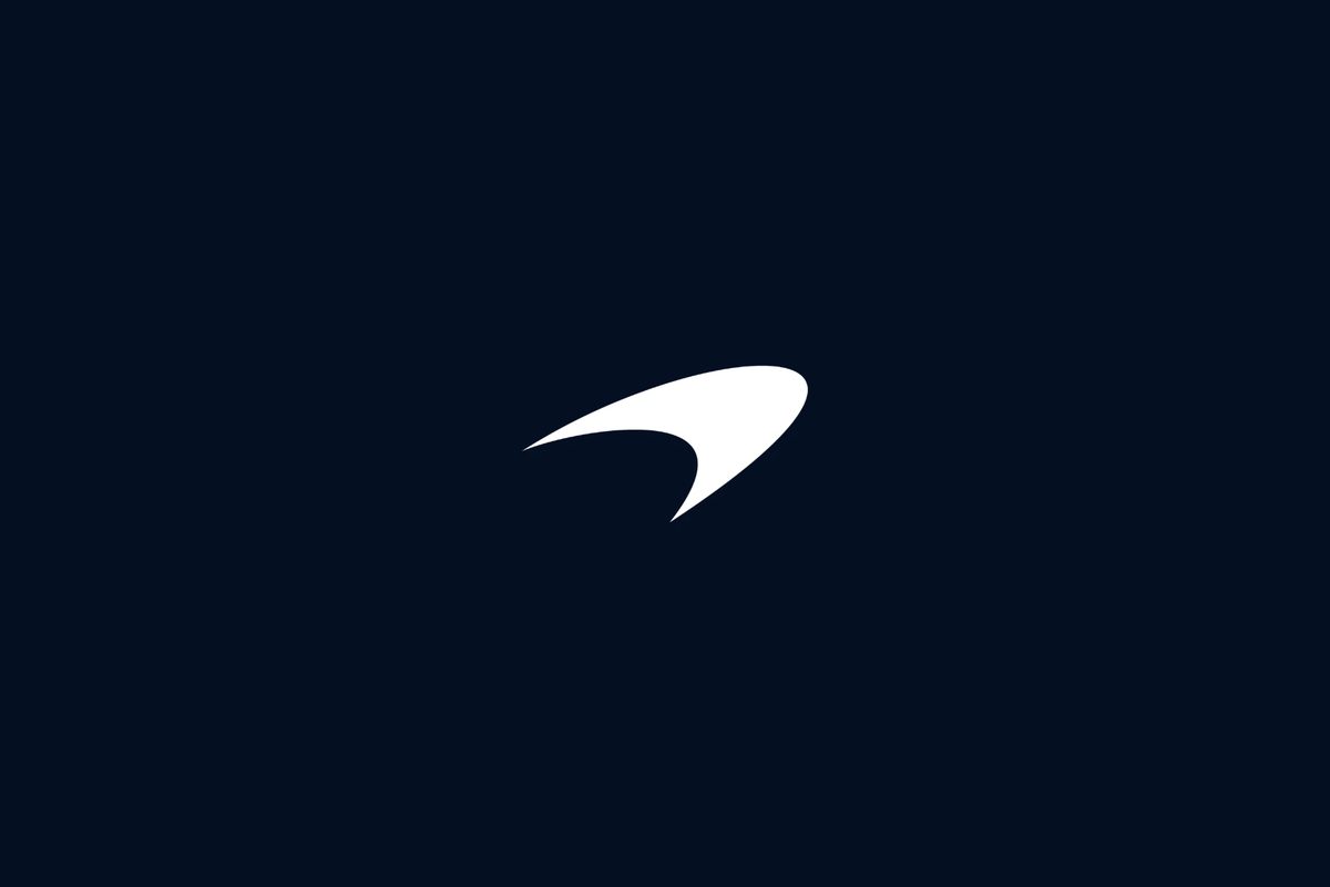 The McLaren Speedmark emblem in white on navy